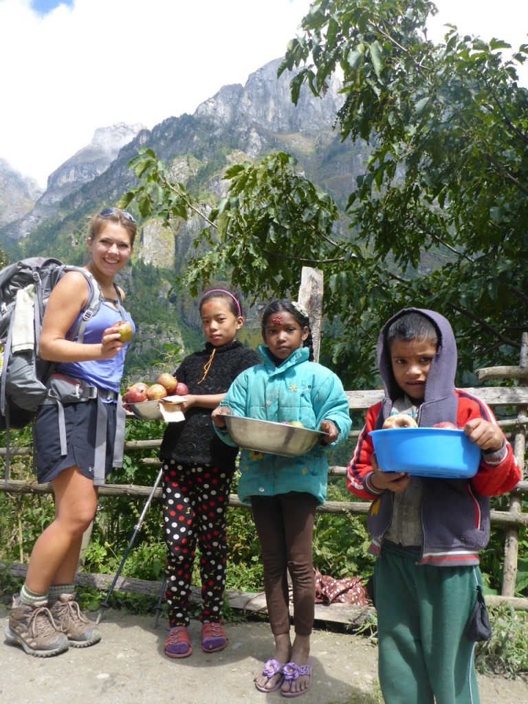 Kids selling apples on the road side.