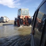 Getting towed across the river.